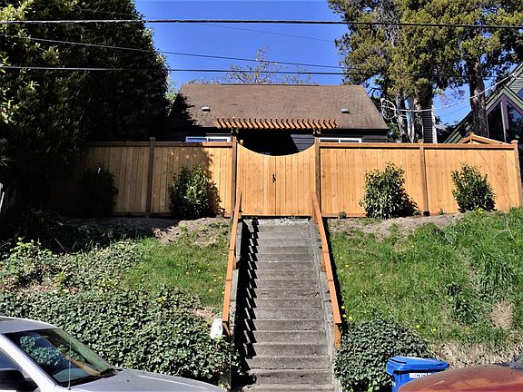 Entry to home. Recently built cedar fence surrounds entire property.