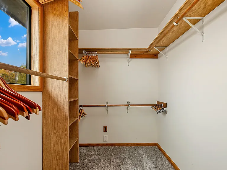 Primary bedroom walk-in closet.