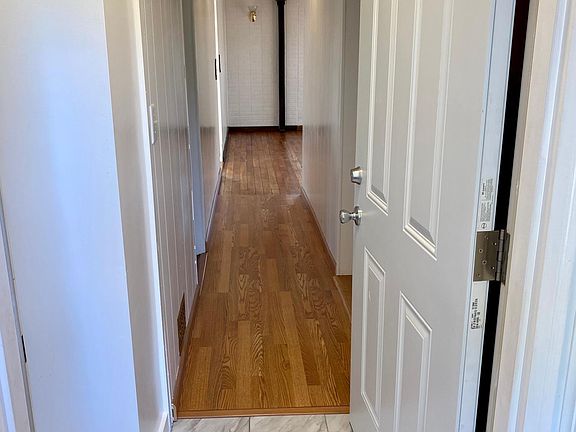 Entrance hall, both bedrooms are on the left, bathroom is first door on the right and then the kitchen.