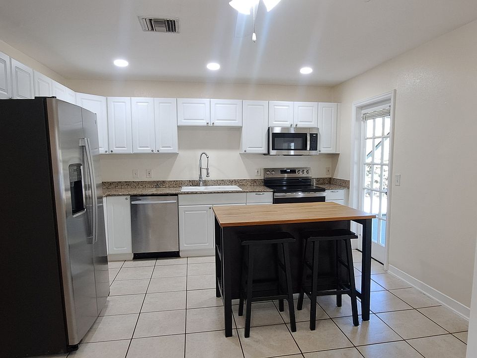 Kitchen with door to screened porch