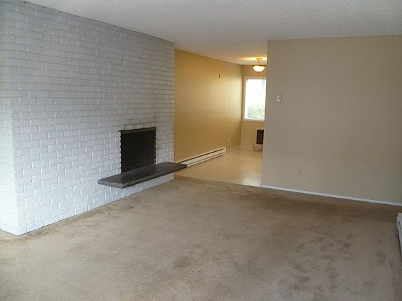 Living room with brick FP