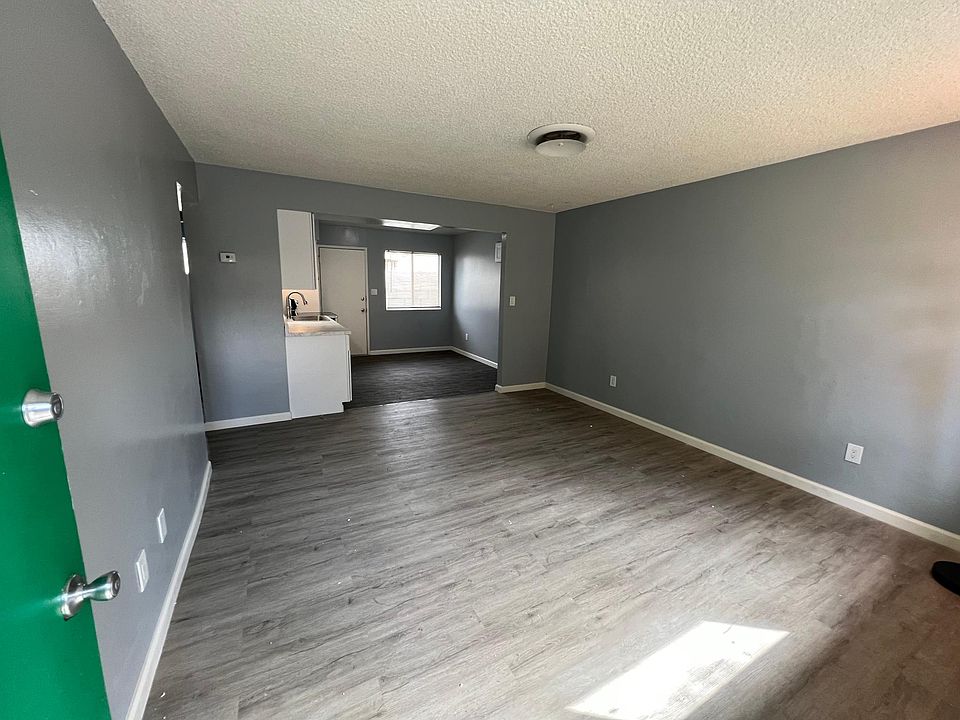 Open floor plan living room which connects into the kitchen