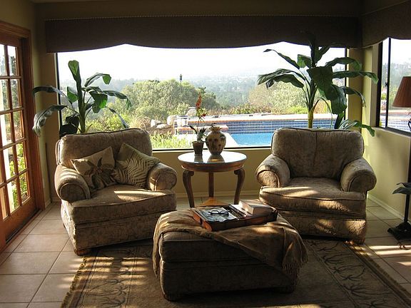 Family room overlooking pool & view