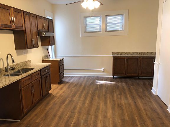 More cabinetry and countertops to the right