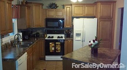 3 Season Room
						:
						Screened in Deck overlooking fenced yard, landscaped firepit, and playset