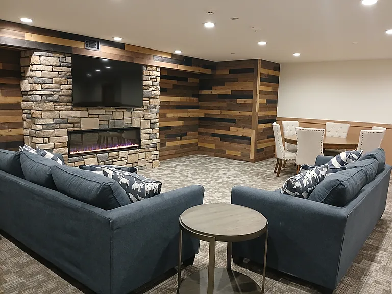 Community Room With Large Screen TV & Fireplace