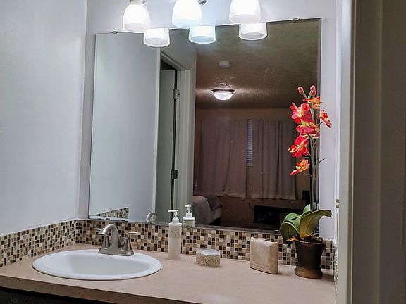 Vanity area with lighting
