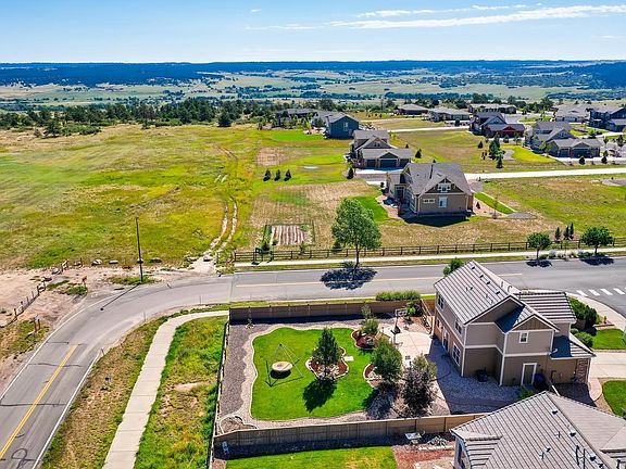 This home backs up to hike and bike trails that wind through the community