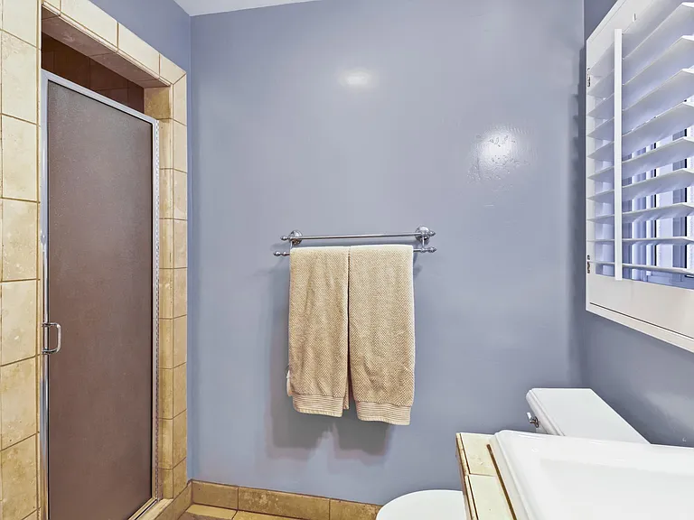 View of shower entrance in second bathroom