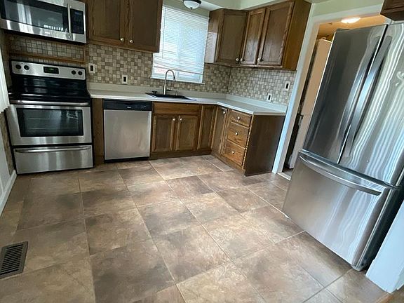 Eat in kitchen with appliances