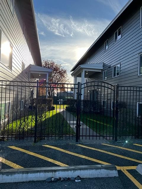 Newly painted 810 on the left, 824 on the right, fenced and security entrance building.