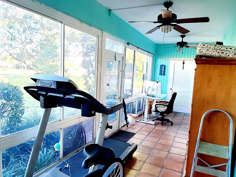 Porch with 3 fans and entrance to Dryer closet.