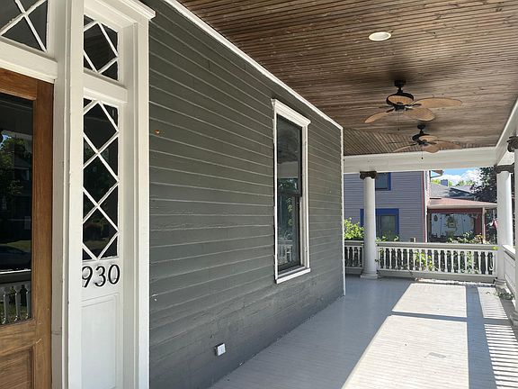 wrap around front porch with 3 fans