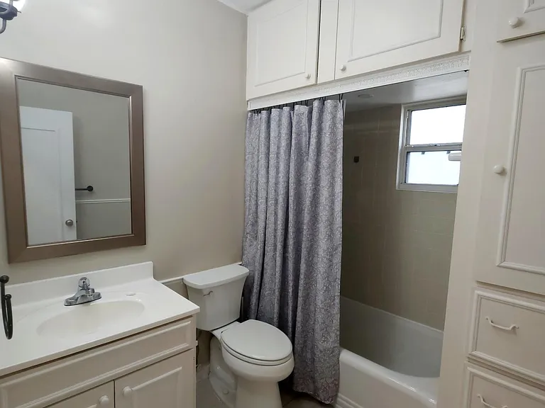 Bathroom with full tub and shower, lot's of extra storage