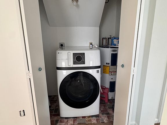 Laundry room with all-in-one washer/dryer