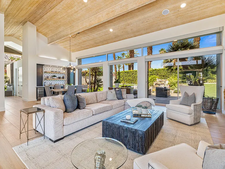 Main house living room with dining and wet bar
