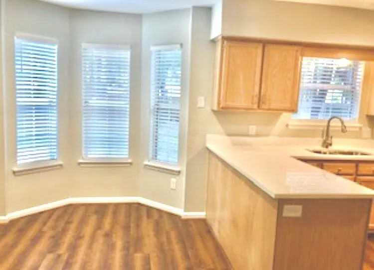 Eat-in kitchen with bay window.