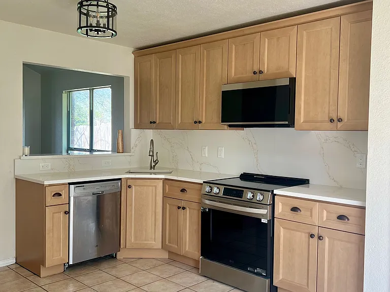 New kitchen cabinets, quartz counters and backsplash and new SS appliances.