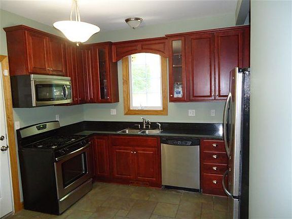 220 Cedarwood Kitchen Gas Range, Microwave and Dishwasher