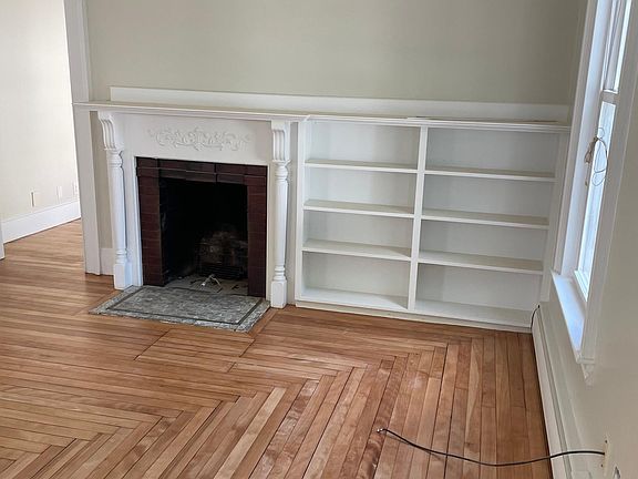 Living Room built-in bookcase. fireplace is piped for natural gas - no insert currently.