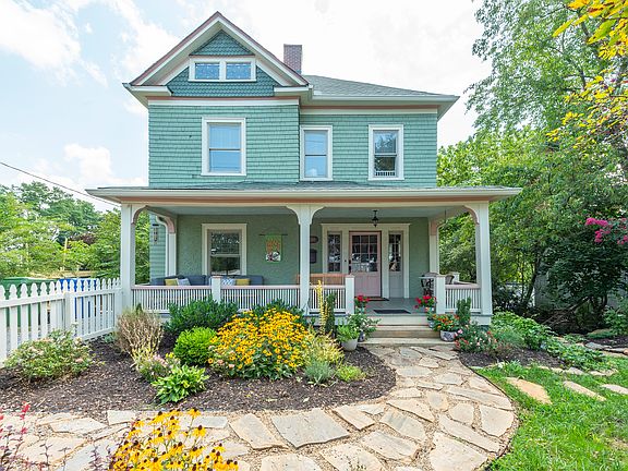 Front of home with lush landscaping