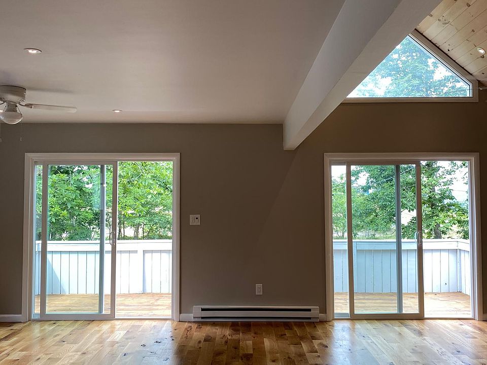 Main living room with two sliding glass doors