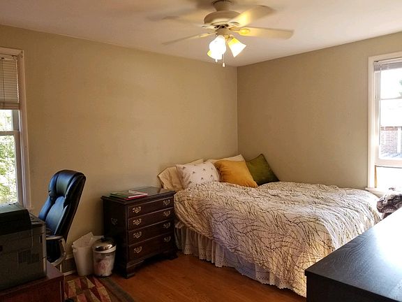 Large bedroom faces south and west. Furniture not included.