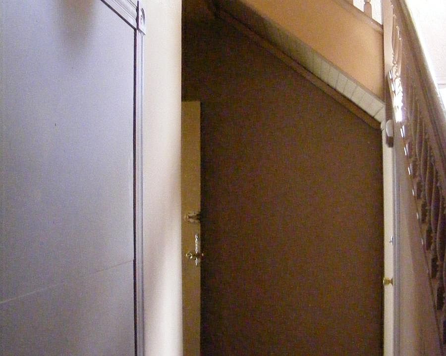 Hallway leading to apartment door