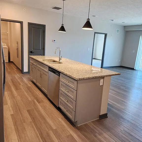 Kitchen island with sink and dishwasher at The Harbor.