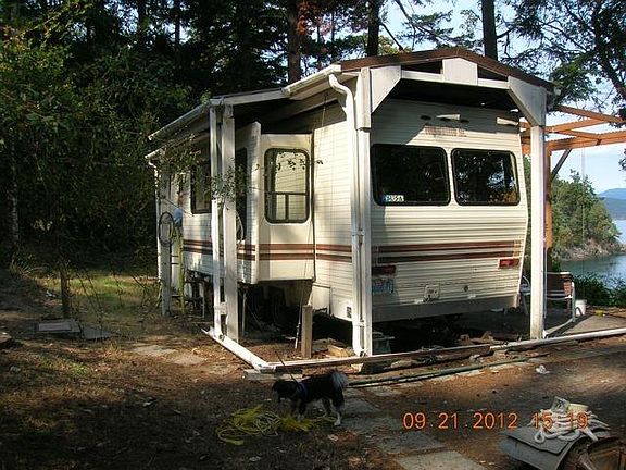 full wooden cabin built over with metal roof.
