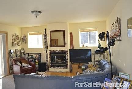 living room
						:
						with sliding glass door to covered deck, great for outdoor entertaining