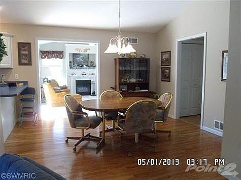 Dining Area with view of family room with gas fireplace