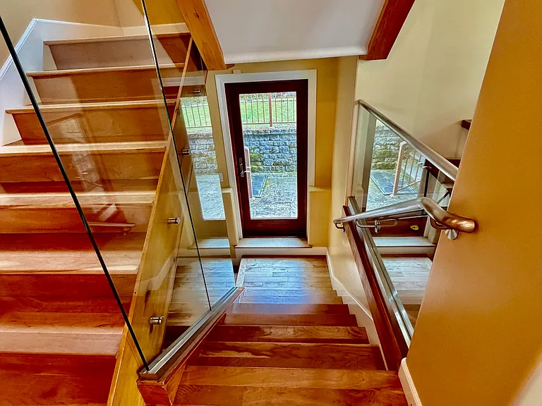 Staircase, picture taken from 2nd floor next to the kitchen, with access to garden below, and stairs to two third floor bedrooms and one bathroom upstairs.