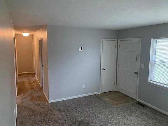 Front door, front window, coat closet and hall way.