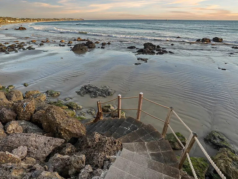 Find calm where the tides meet the rugged shore.