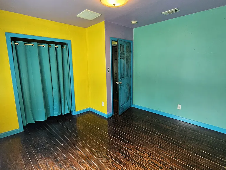 Third Bedroom down the hall with windows facing the front yard