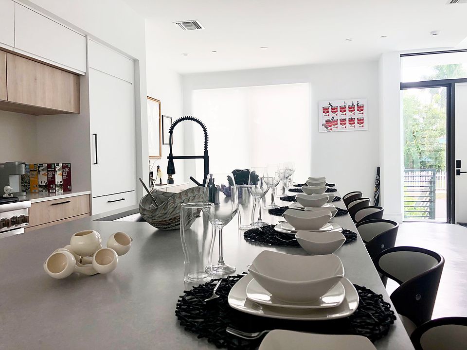 The 15-foot kitchen island serves as the heart of the home, creating a lively space for guests to gather. Featuring top-of-the-line Thermador appliances, guests can watch or interact with the chef, making it an engaging and social experience.