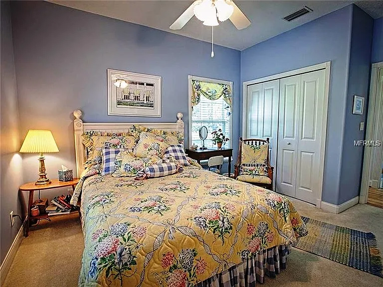 This is the Guest BR/ BA which overlooks the wraparound porch and the front yard
