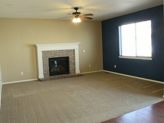 Freshly painted living room as seen from kitchen entry.