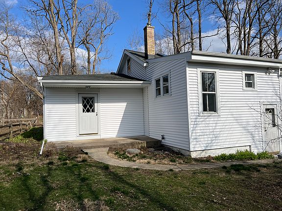 Rear entry. 
15' x 10' covered porch.
West facing.