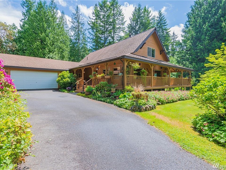 757 NE Trinity Lane - Poulsbo.  Log home with wrap-around covered porch!