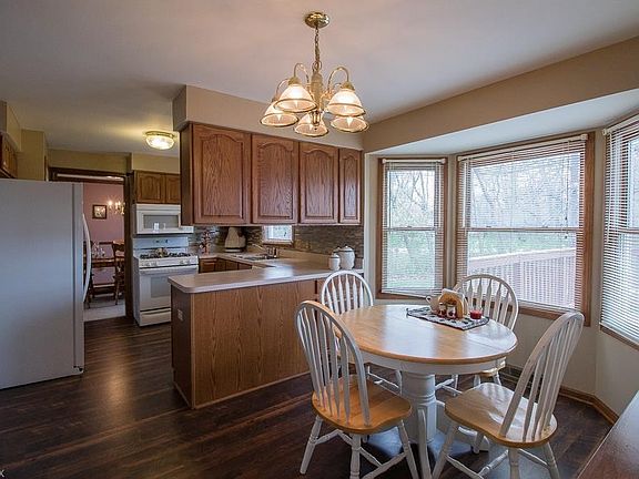 Breakfast area with new laminate floor, tile backsplash, updated paint