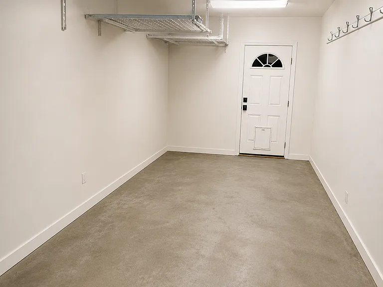 9'0" x 19'0" attached garage can fit a small car or great for storage, workspace, etc. Has an entrance off the side of the kitchen and an entrance to the backyard.