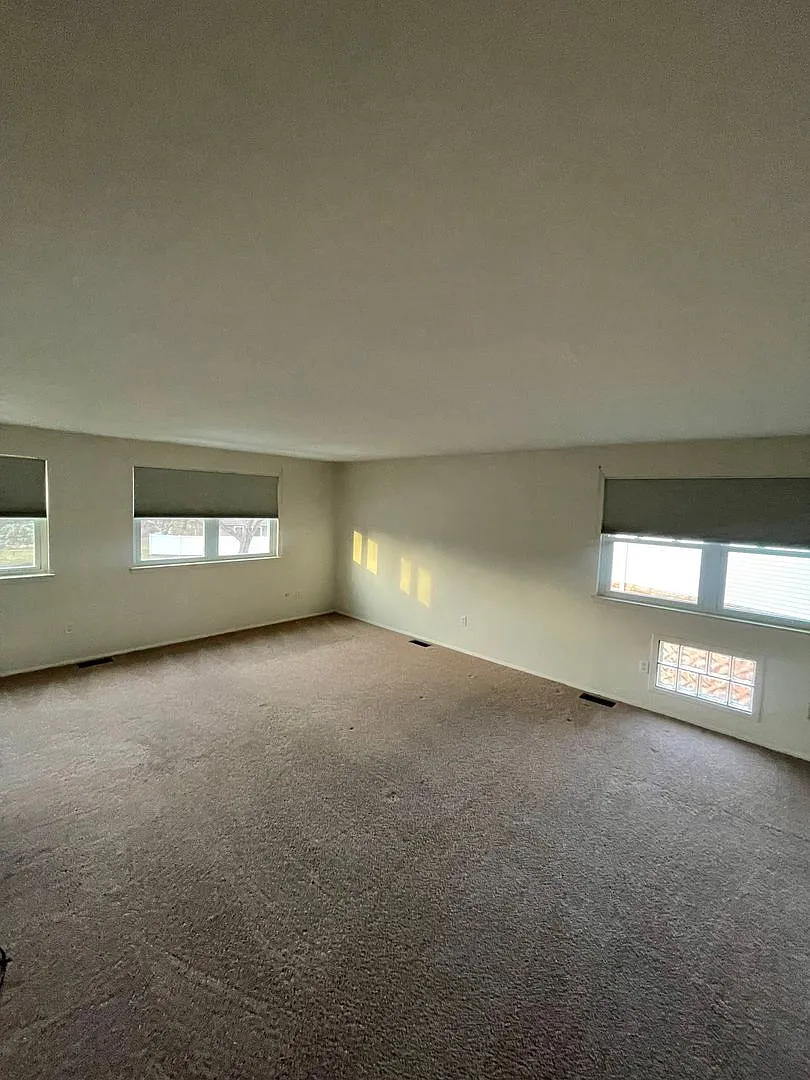 Spacious & Updated Novi Colonial | Vaulted Ceilings, Fireplace & Private Deck — Photo 3