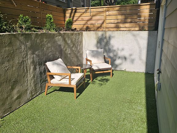 Private Entrance with small garden. Lawn Maintenance provided by owner