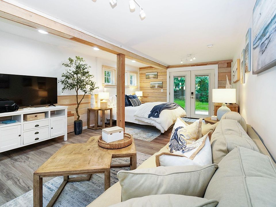 Master Bedroom with living room are and smart TV