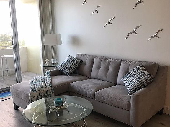 Fully furnished includes a queen sofa bed, side and cocktail tables in living room.
