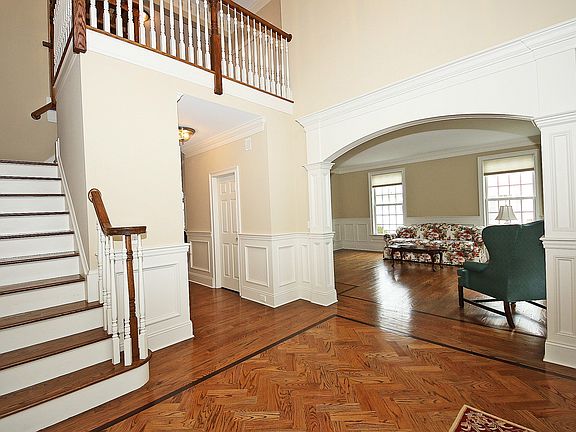 Two story entry foyer with half bath