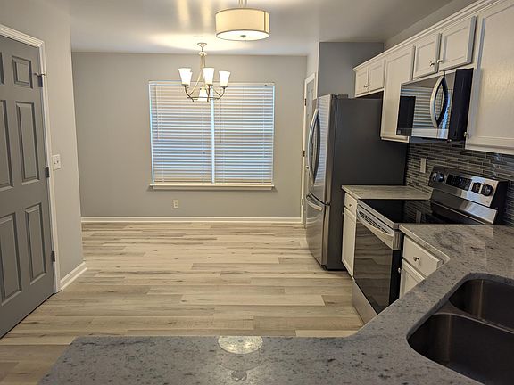 Beautiful, spacious kitchen with brand new appliances, counters and fixtures. Perfect gathering spt