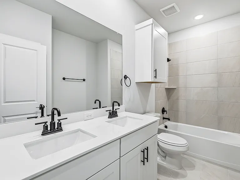 Upstairs bathroom with dual sinks
